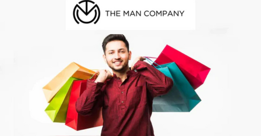 Indian man holding shopping bags in festive season